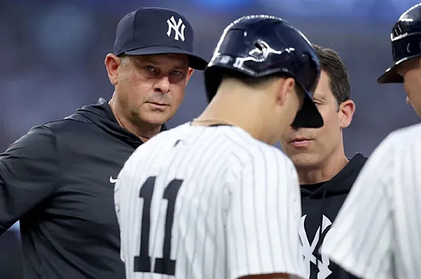 Aaron Boone and Anthony Volpe at a Yankees game.
