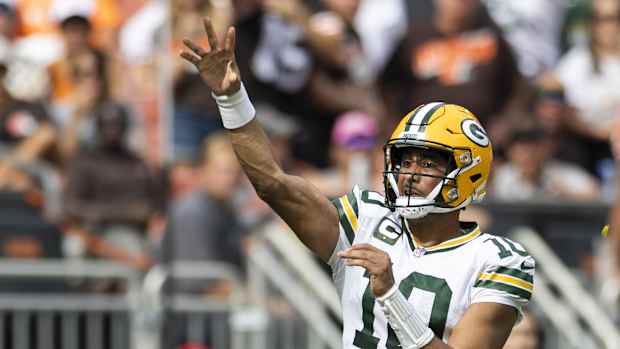 Jordan Love throws a touchdown pass.